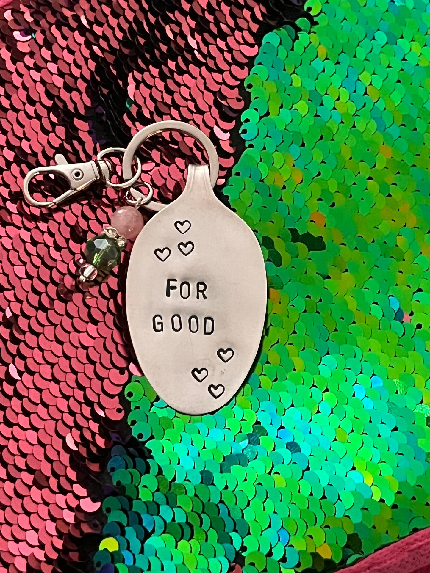 For Good.   Keychain/clip on