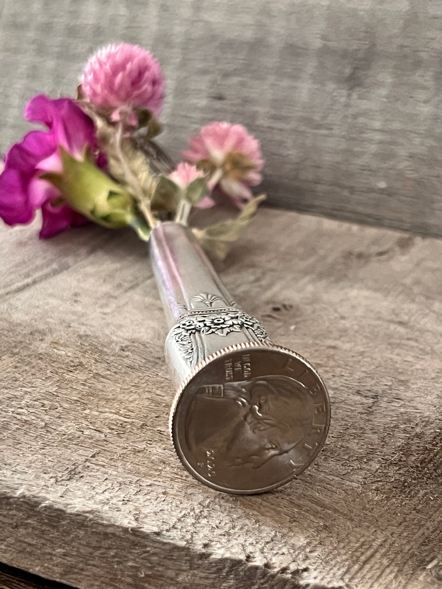 Bud Vase Soldered onto a Quarter.  Pattern: First Love, Vintage 1937