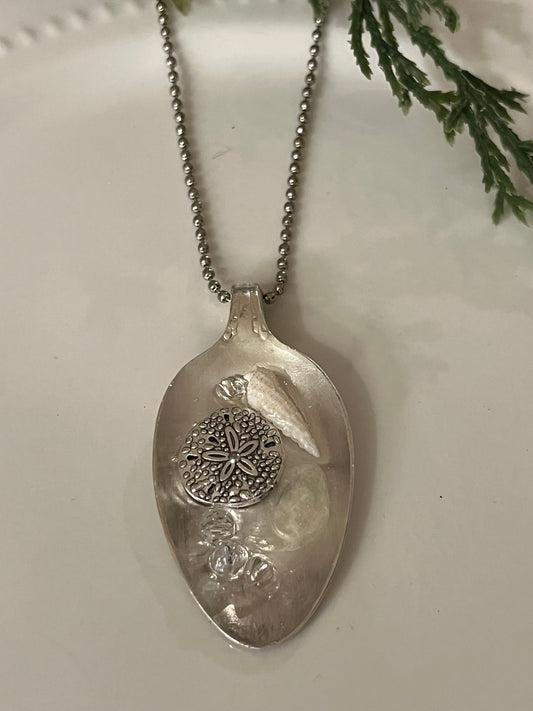 Silver sand dollar with shells Resin Pendant